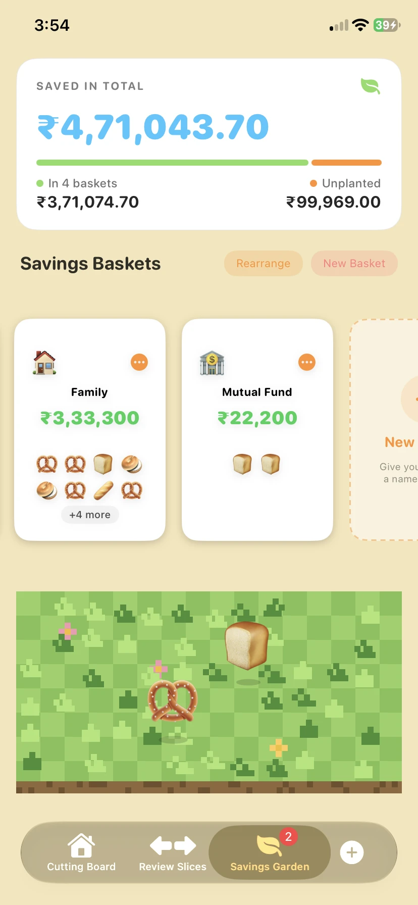 The Savings Garden in LOAF, with total savings at the top, baskets called Family and Mutual Fund, and a loaf and a pretzel sitting on the grass.